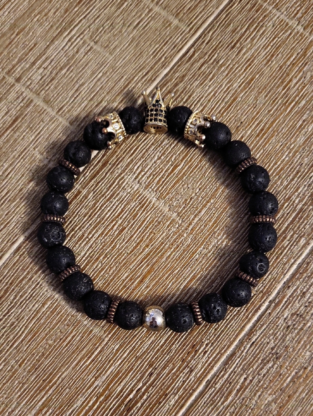 Natural Black Lava Stretch Bead Bracelet With Gold Tone Crown Beads